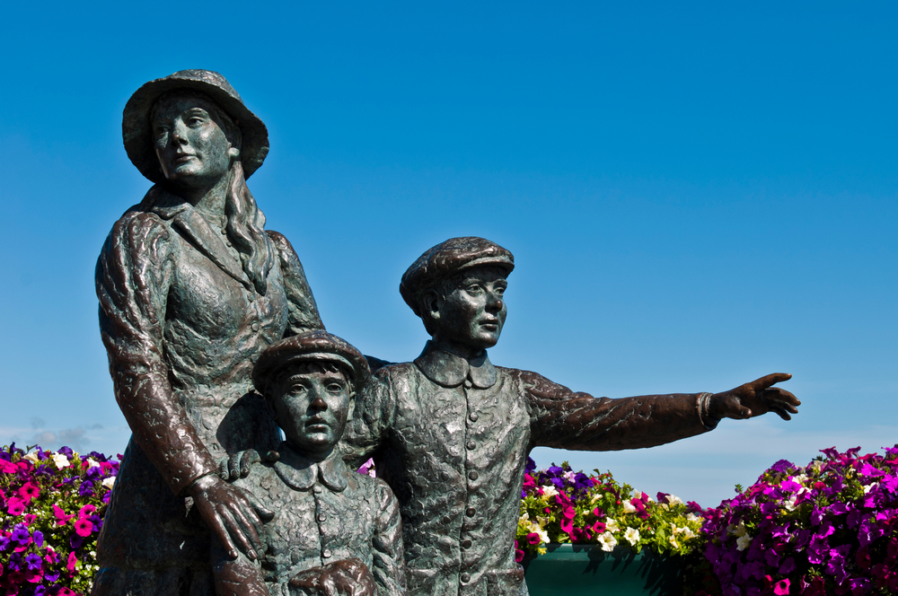statue of Annie Moore A statue of Annie Moore and her two young brothers stands near the harbor in Cobh, Ireland